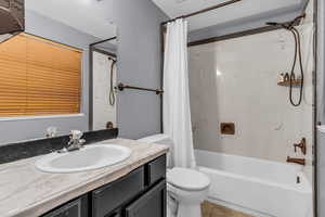 Bathroom with vanity, shower / bath combination