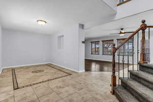 Foyer entrance featuring light Travertine patterned floors