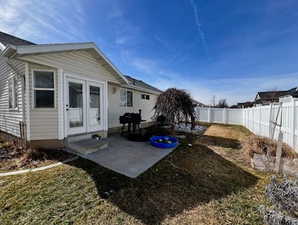 Back of house featuring a patio and a fenced backyard