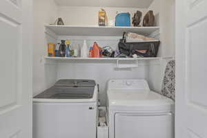 Laundry area featuring independent washer and dryer