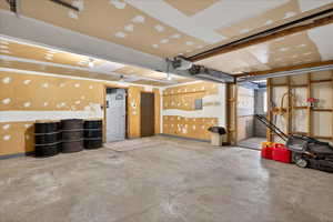 Garage featuring a garage door opener