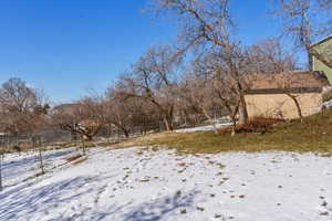 View of yard covered in snow