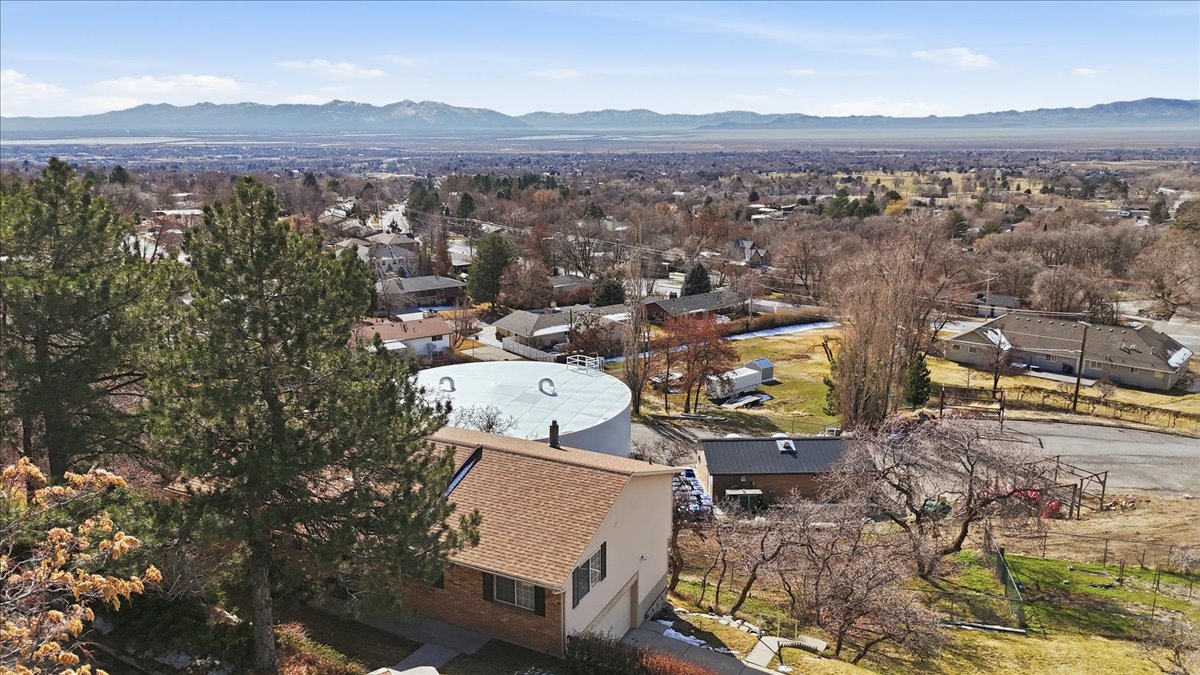 Aerial view of residential area featuring mountains