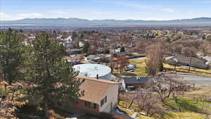 Aerial view of residential area featuring mountains