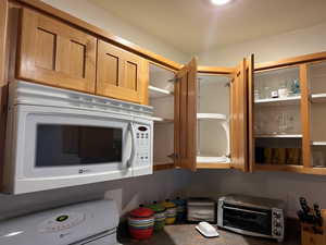 Kitchen view of white appliances