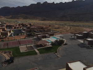 Aerial view of residential area with a pool and mountains