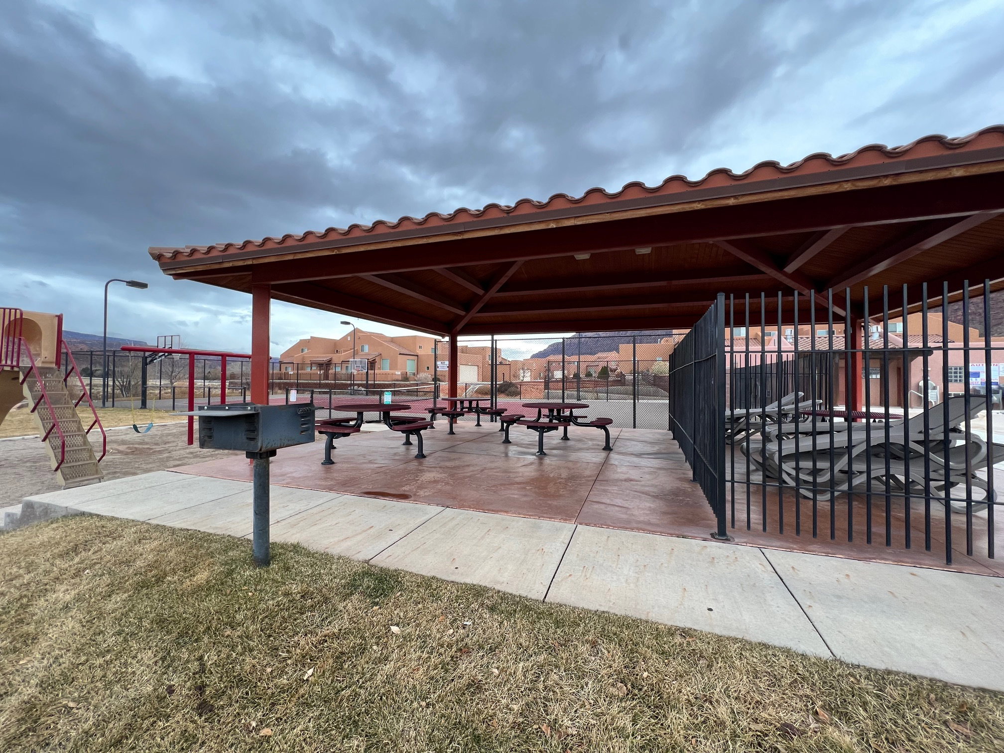 Surrounding community with a patio, pool, and tennis