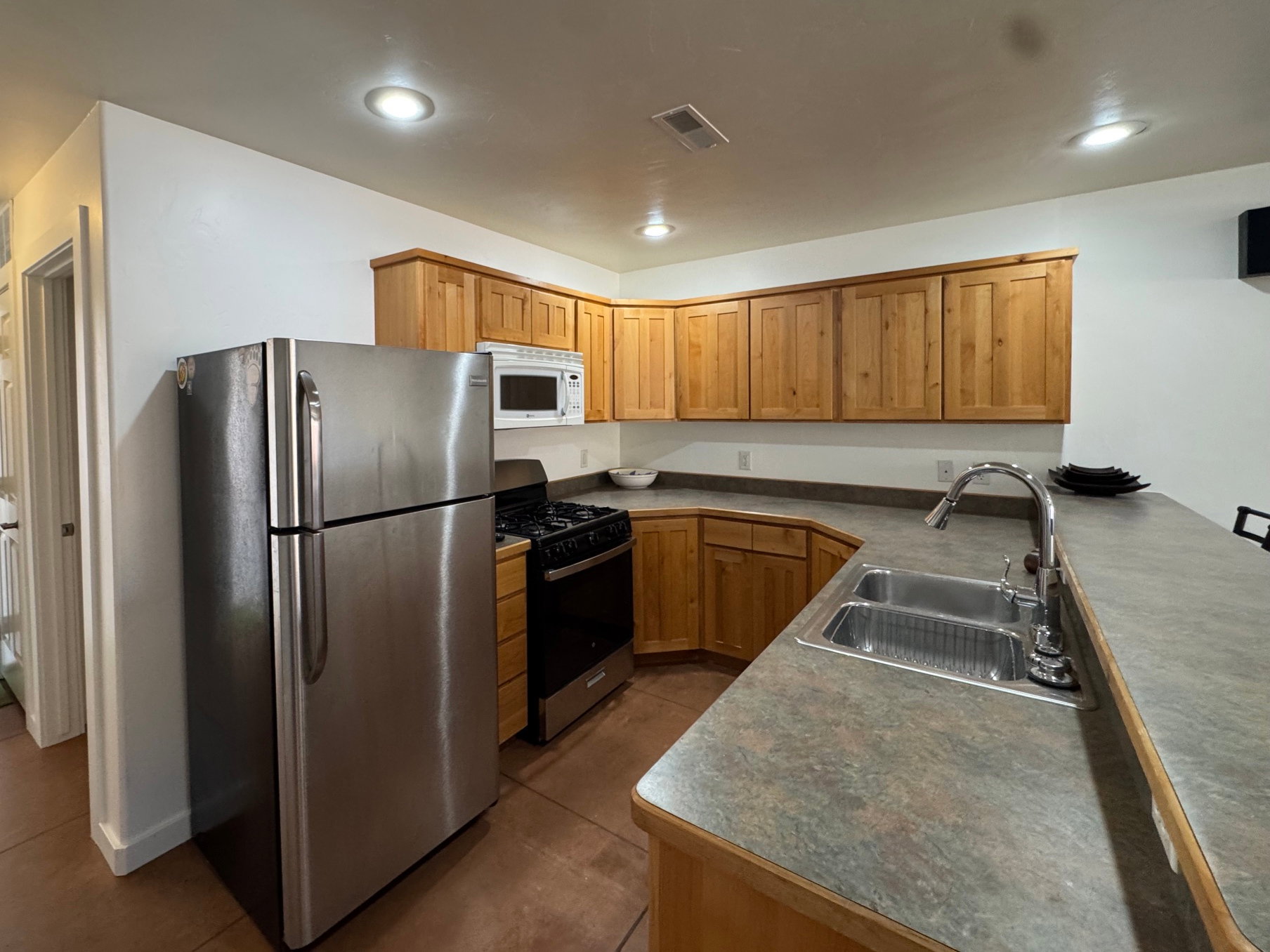 Kitchen with wood cabinets