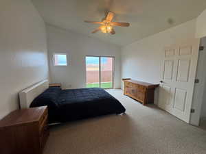 Bedroom featuring access to outside, a ceiling fan, light carpet, and vaulted ceiling
