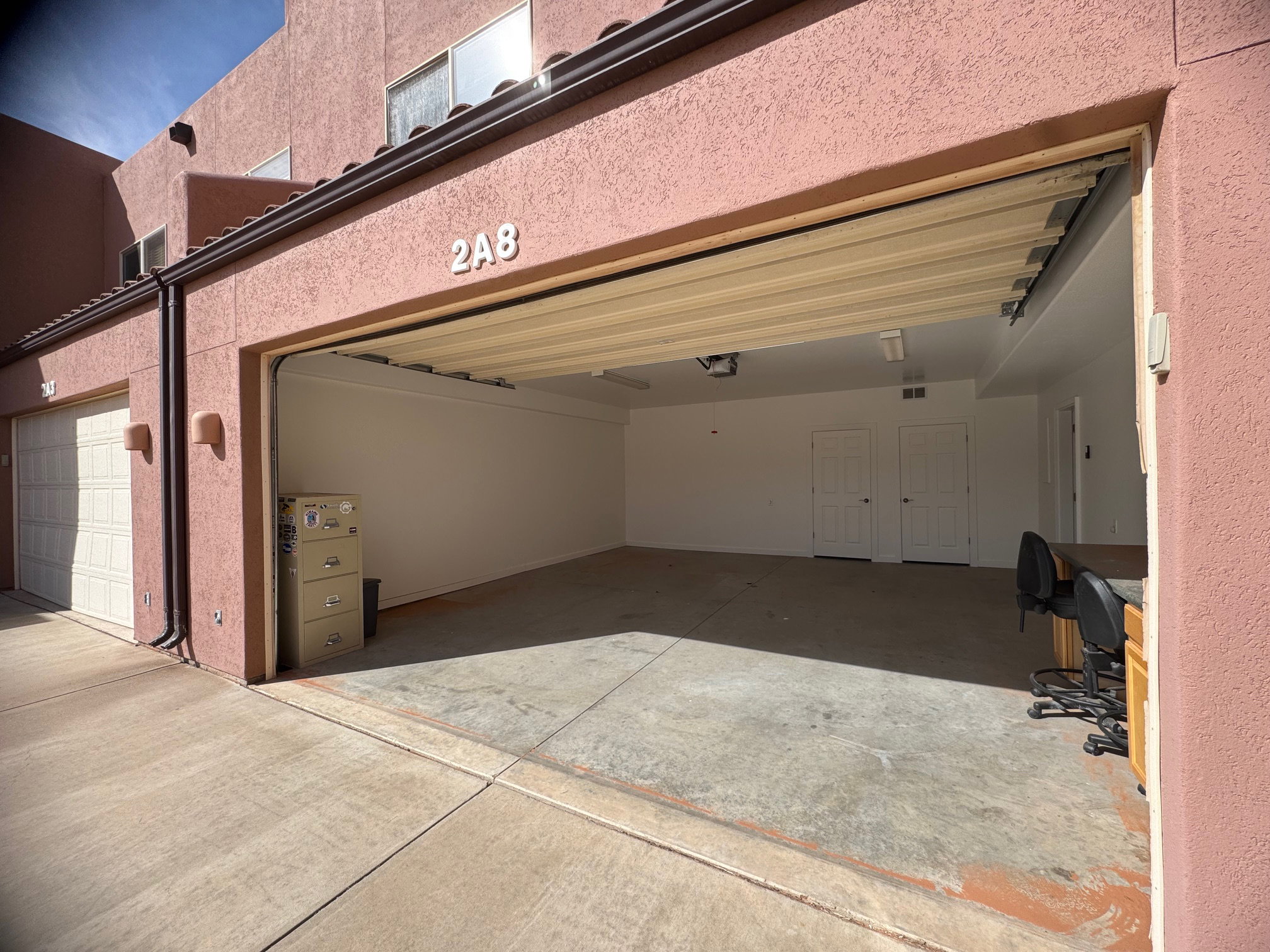 Huge 2 car garage with oversized door.  Great owners closet and work area.