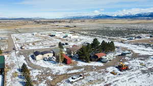 Aerial overview of property's location featuring nearby suburban area and rural landscape