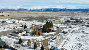 View of property location featuring a mountain backdrop and nearby suburban area