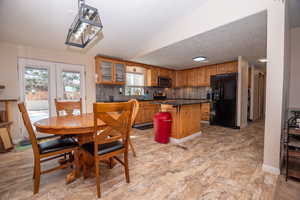 Dining area featuring baseboards and french doors