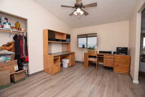 Office area featuring a ceiling fan and light wood finished floors