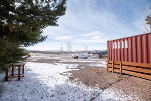 View of yard layered in snow