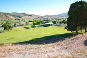 View of mountain backdrop with rural landscape