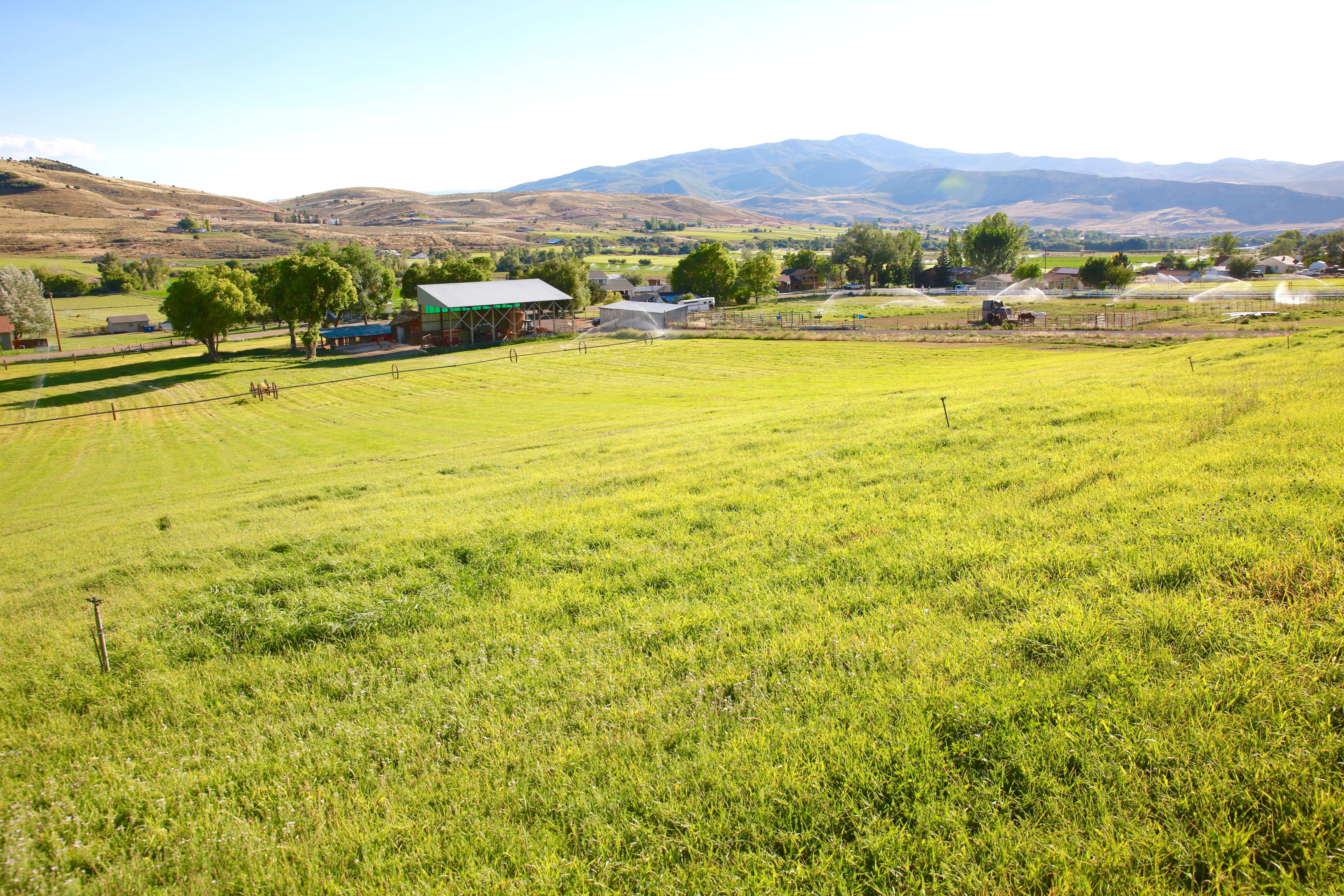 View of mountain backdrop with rural landscape