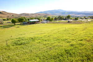 View of mountain backdrop with rural landscape