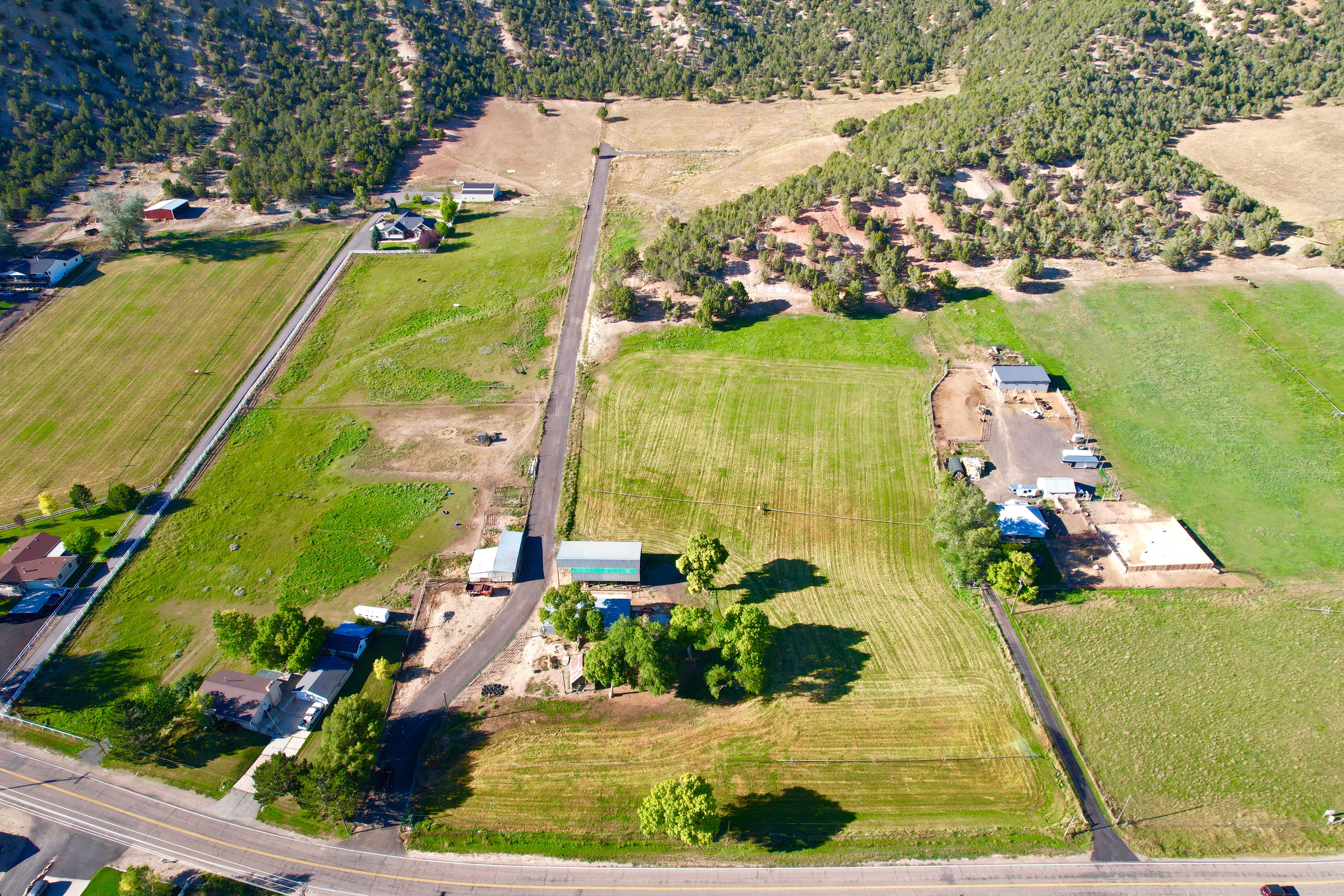 Aerial view of property and surrounding area featuring rural landscape