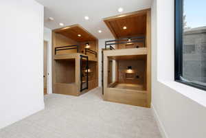 Hallway featuring carpet floors and recessed lighting
