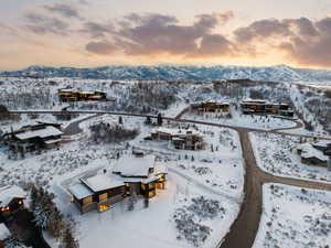 Snowy aerial view featuring a mountain view