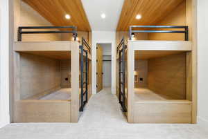 Unfurnished bedroom with carpet floors and recessed lighting