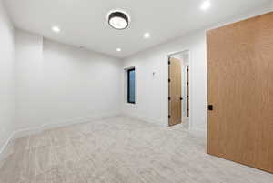 Spare room featuring light carpet and recessed lighting