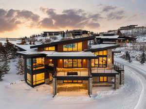 View of snow covered rear of property