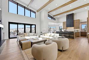 Living room featuring light wood-style flooring, recessed lighting, and a mountain view