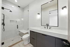 Full bath with vanity, a stall shower, and recessed lighting