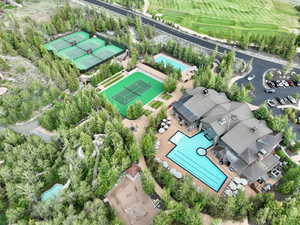 Aerial view of a pool area and a local golf course