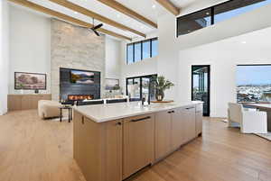 Kitchen featuring modern cabinets, light wood finished floors, open floor plan, and recessed lighting