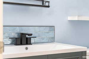 Bathroom detail featuring custom tile work