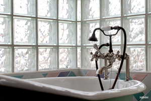Bathroom view of a sink and a freestanding tub