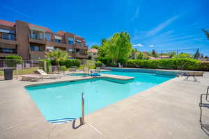 Community pool featuring a patio area