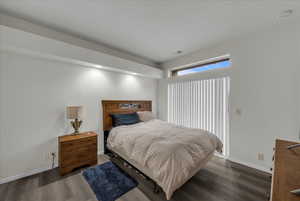 Bedroom featuring wood finished floors and recessed lighting