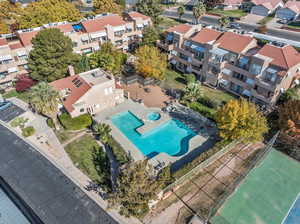 Aerial view of residential area featuring a pool