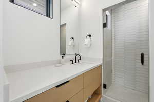Full bathroom with a stall shower and vanity