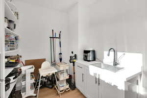 Laundry room with light wood-style floors