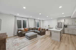 Living area featuring recessed lighting and light wood-style floors