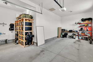 Garage with a sink and a garage door opener