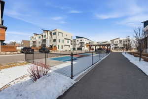 Snow covered pool with a gazebo and a patio