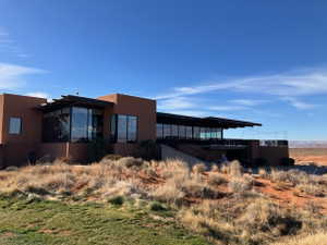 View of side of home featuring a deck