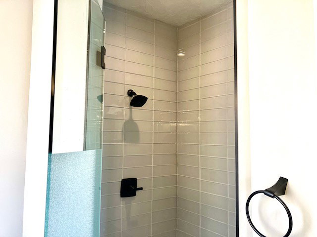 Full bath with a shower stall