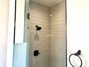 Full bath with a shower stall