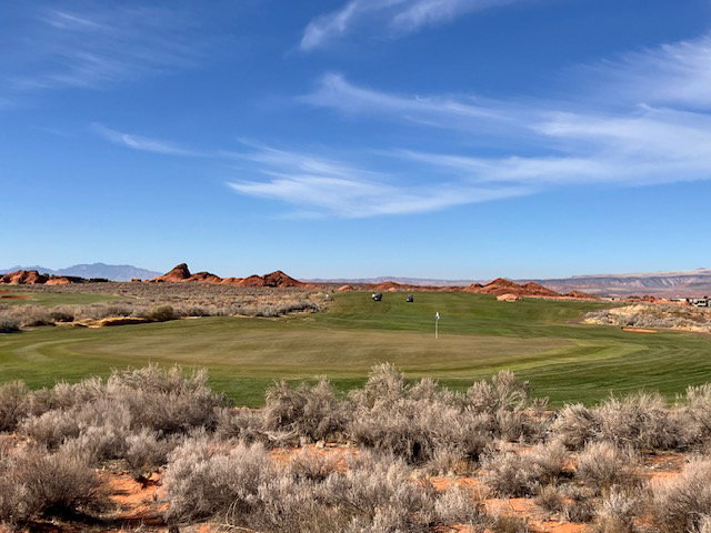 View of community featuring a mountain view and view of golf course