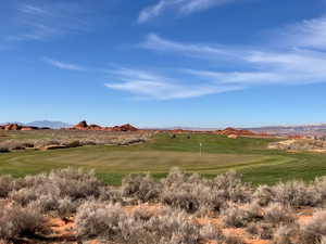 View of community featuring a mountain view and view of golf course