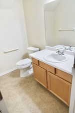 Master bathroom with vanity and toilet