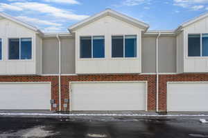 View of front of home featuring a garage and board and batten siding