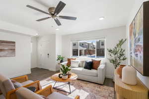 Living room featuring wood finished floors, a ceiling fan, and recessed lighting
